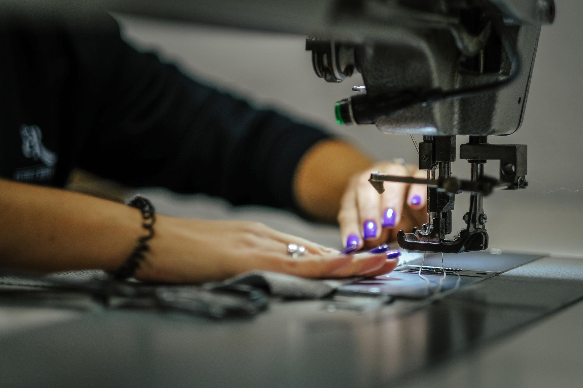 Workshop bench with embroidery machine in motion